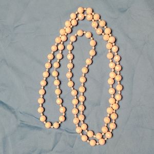 String of irredescent pale pink beads